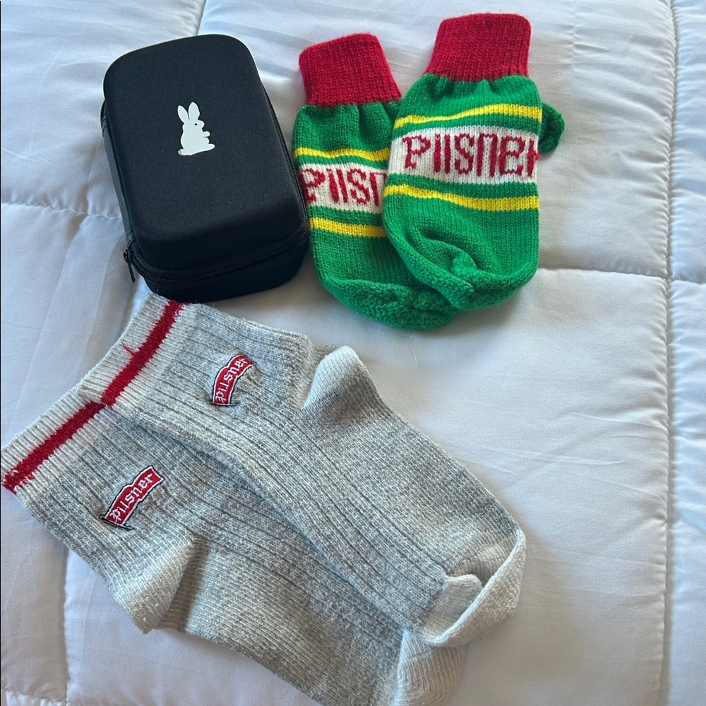 Pilsner socks, mittens , travel case with dice , bandaids ,